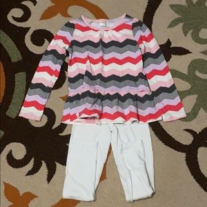 White pants and striped shirt